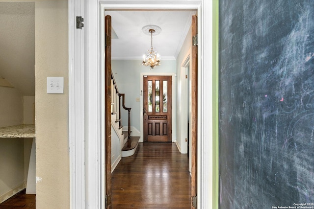 interior space featuring a notable chandelier, stairway, dark wood-style flooring, and crown molding