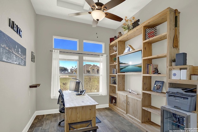 office space featuring ceiling fan, baseboards, and wood finished floors