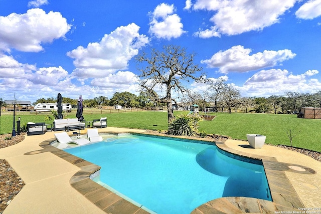 view of swimming pool featuring a yard, a patio, fence, and a fenced in pool