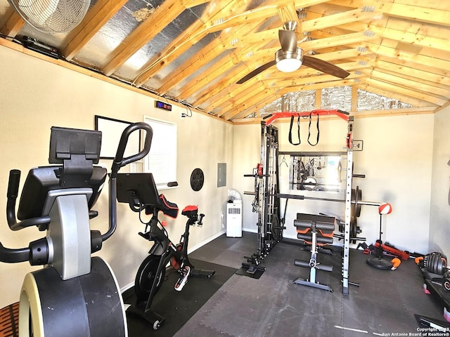 exercise area featuring lofted ceiling, electric panel, a ceiling fan, and a wealth of natural light