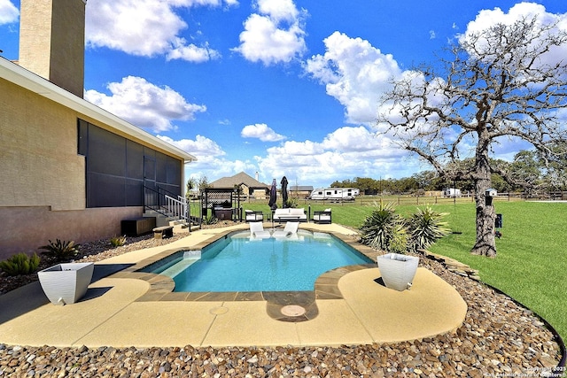 view of swimming pool with a yard, a patio area, a fenced backyard, and a fenced in pool