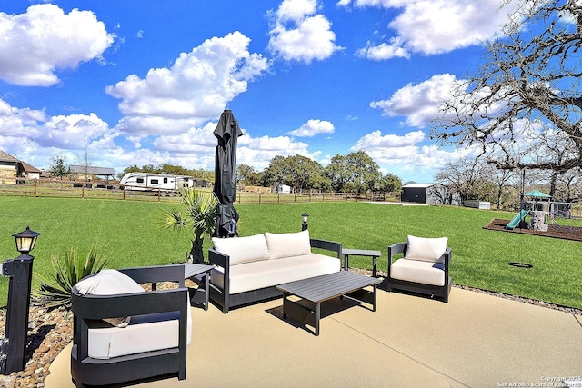 view of patio / terrace featuring a playground, fence, and outdoor lounge area