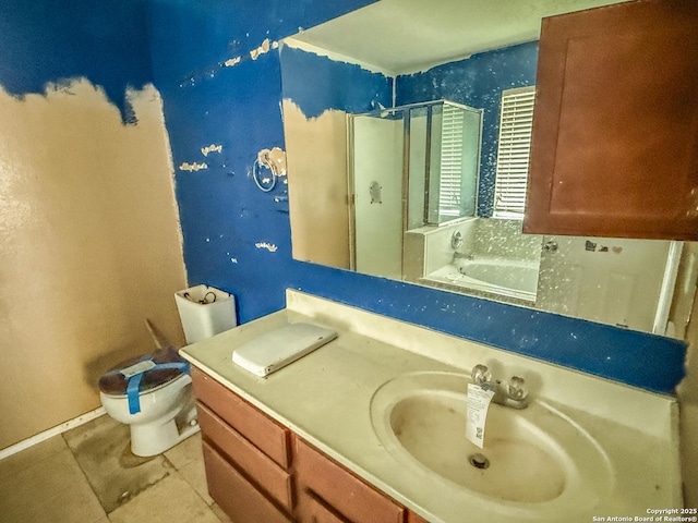 bathroom featuring toilet, a stall shower, tile patterned flooring, and vanity