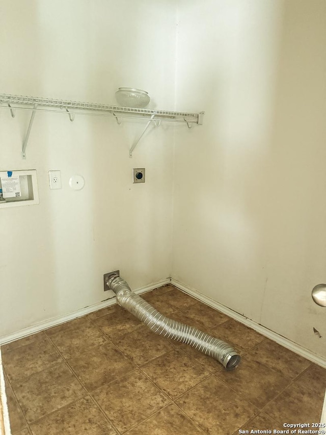 laundry area featuring laundry area, gas dryer hookup, tile patterned floors, hookup for a washing machine, and hookup for an electric dryer