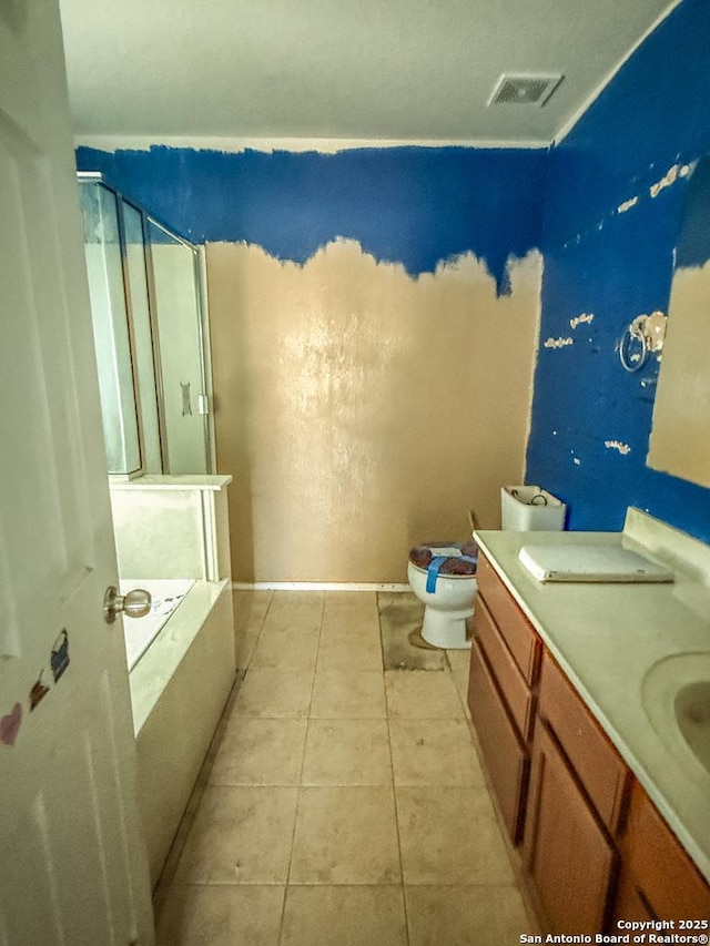 full bathroom featuring tile patterned flooring, toilet, a bathing tub, visible vents, and a shower with door