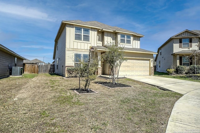 view of front of home featuring an attached garage, central AC, fence, driveway, and board and batten siding