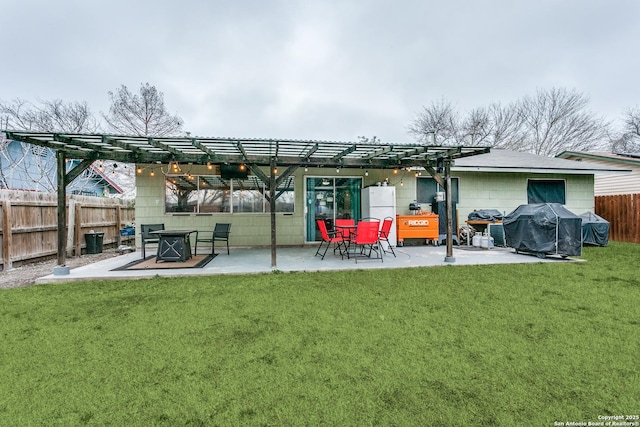 rear view of house featuring a patio area, fence, a pergola, and a lawn