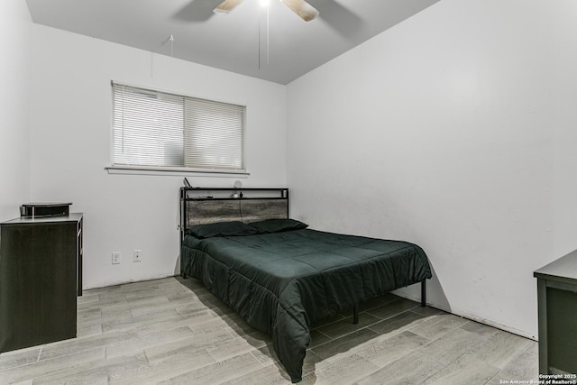 bedroom featuring a ceiling fan and wood finished floors