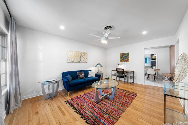 living room featuring recessed lighting, visible vents, ceiling fan, wood finished floors, and baseboards