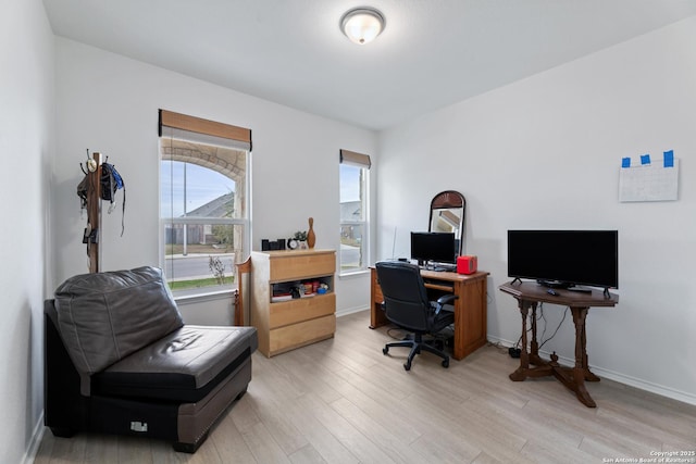 office featuring light wood-style flooring and baseboards