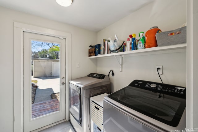 laundry area featuring washer and clothes dryer and laundry area