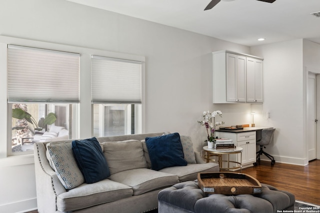 living room featuring visible vents, baseboards, a ceiling fan, dark wood finished floors, and recessed lighting