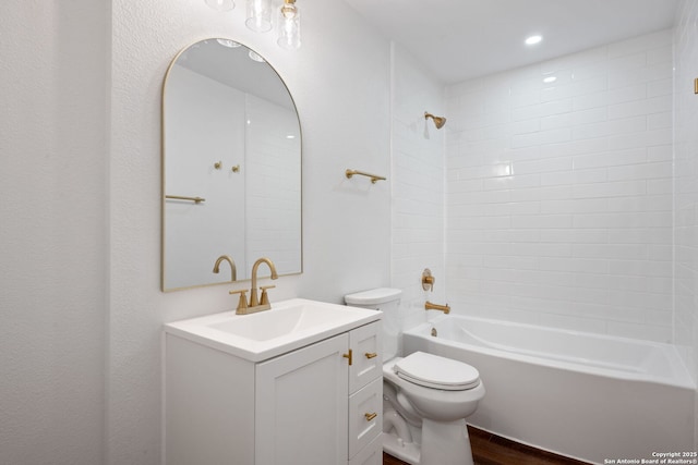 full bath featuring toilet, shower / bathing tub combination, wood finished floors, and vanity