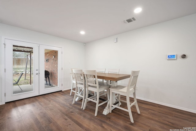 dining space with french doors, recessed lighting, visible vents, wood finished floors, and baseboards