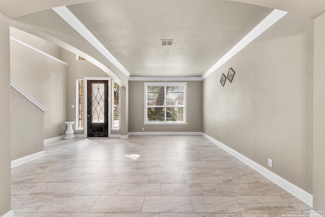 entryway featuring baseboards, visible vents, and crown molding