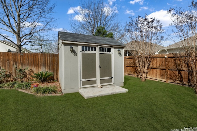 view of shed featuring a fenced backyard