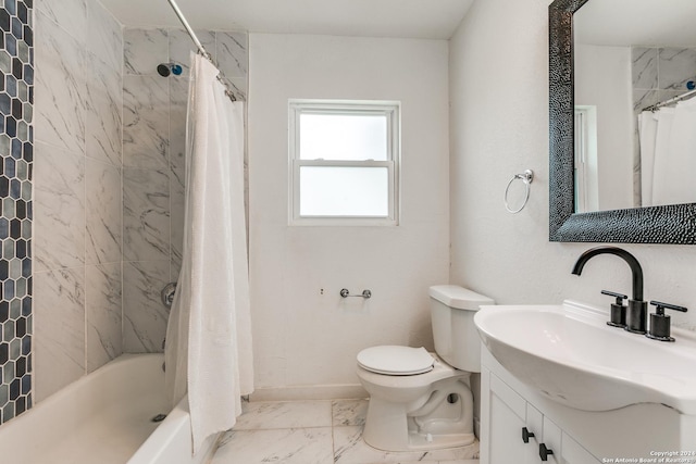 full bathroom featuring marble finish floor, toilet, shower / tub combo, vanity, and baseboards