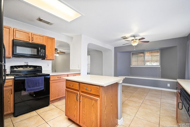 kitchen with arched walkways, black appliances, light tile patterned flooring, and visible vents