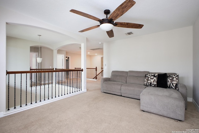 living area with carpet flooring and visible vents