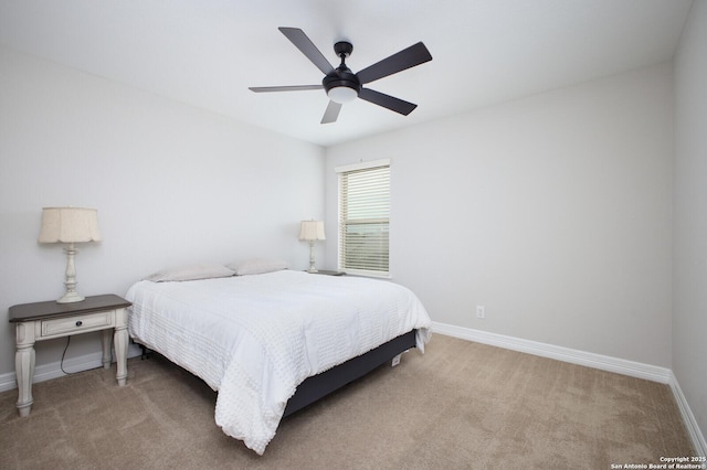 bedroom with carpet floors, ceiling fan, and baseboards