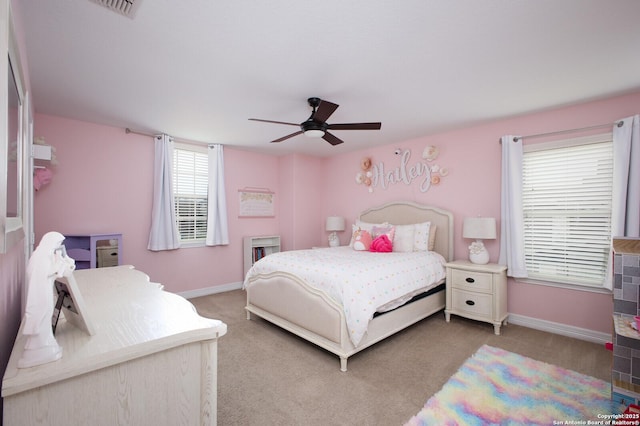 bedroom featuring baseboards, a ceiling fan, and light colored carpet