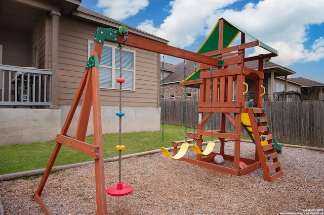 view of play area featuring a yard and fence