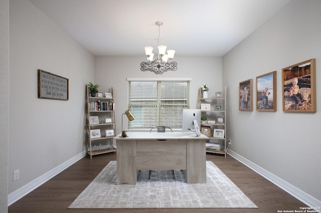 office area with dark wood-style flooring, a notable chandelier, and baseboards