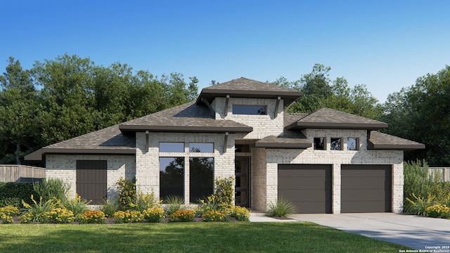 view of front of house with driveway, brick siding, an attached garage, and a front yard