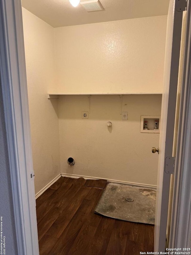 clothes washing area featuring hookup for a gas dryer, laundry area, washer hookup, and wood finished floors