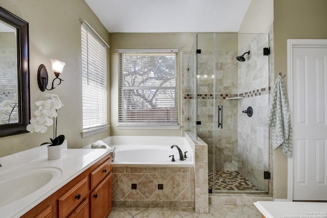 full bathroom with a garden tub, a shower stall, vanity, and tile patterned floors