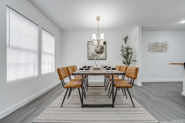 dining room featuring dark wood-style floors, recessed lighting, a chandelier, and baseboards