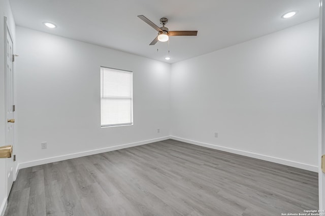 spare room with recessed lighting, ceiling fan, baseboards, and wood finished floors