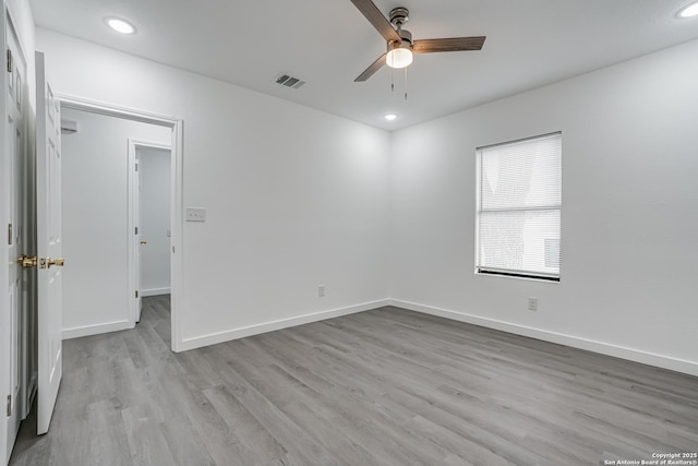 unfurnished room with recessed lighting, visible vents, ceiling fan, light wood-type flooring, and baseboards