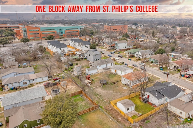 birds eye view of property with a residential view