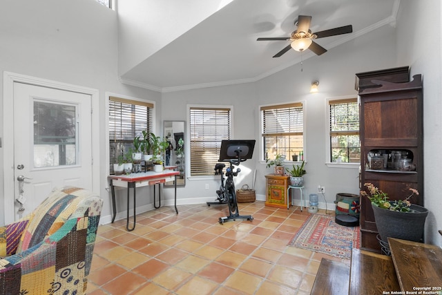 interior space featuring baseboards, a ceiling fan, vaulted ceiling, crown molding, and light tile patterned flooring