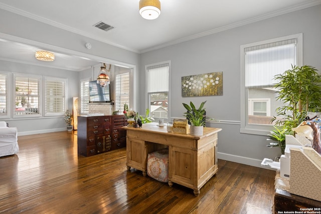 office area with plenty of natural light, visible vents, dark wood-type flooring, and ornamental molding