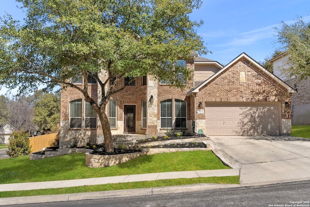 view of front of home featuring a garage, driveway, brick siding, and a front yard