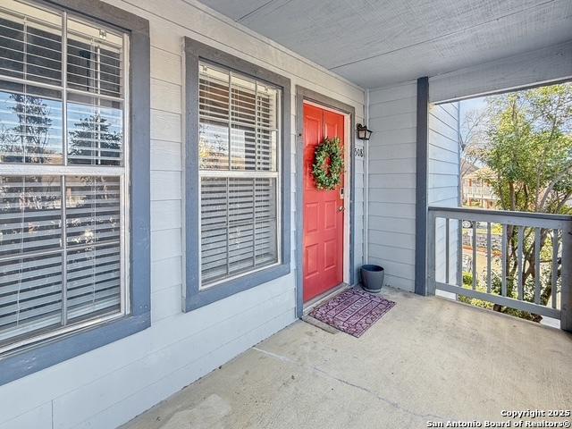 doorway to property featuring covered porch