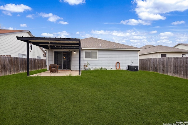 rear view of house with a fenced backyard, a patio, central AC unit, and a lawn