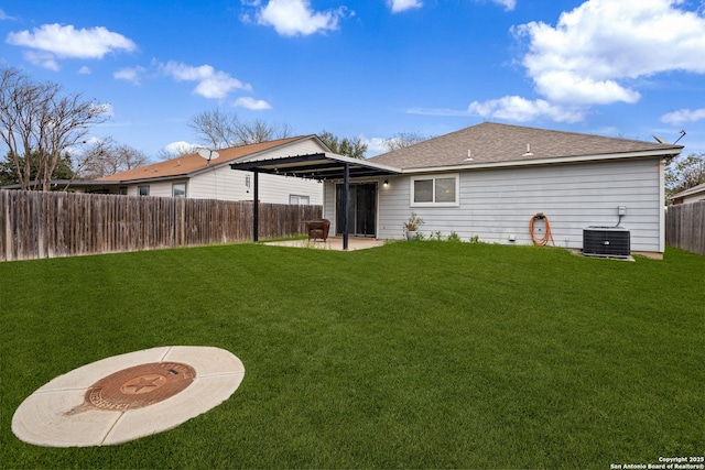 back of property with cooling unit, a patio area, a yard, and a fenced backyard