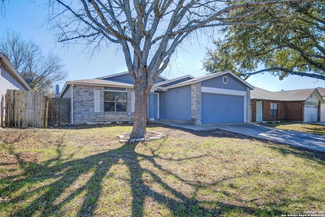 ranch-style home with driveway, an attached garage, fence, a front lawn, and brick siding