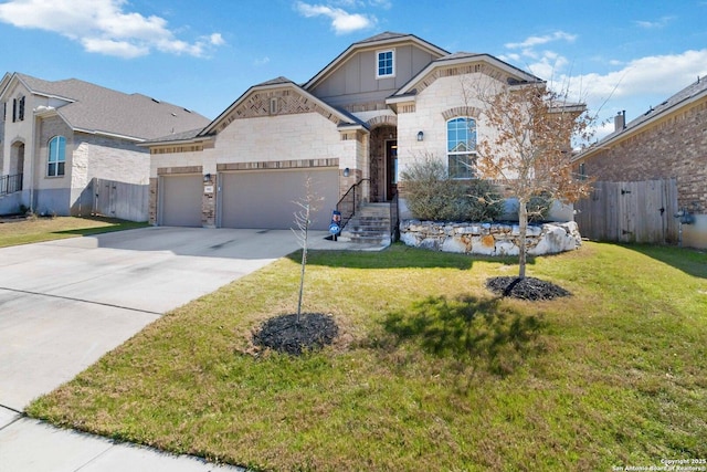 french country home featuring an attached garage, driveway, fence, and a front yard