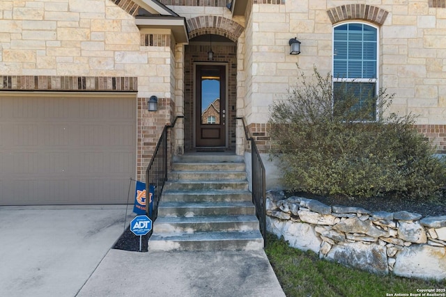 entrance to property with stone siding and brick siding