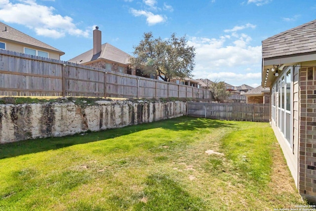 view of yard with fence