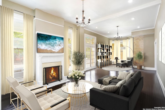 living area featuring a lit fireplace, baseboards, a notable chandelier, and wood finished floors