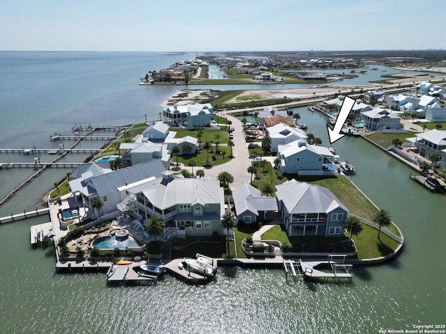 bird's eye view with a water view and a residential view