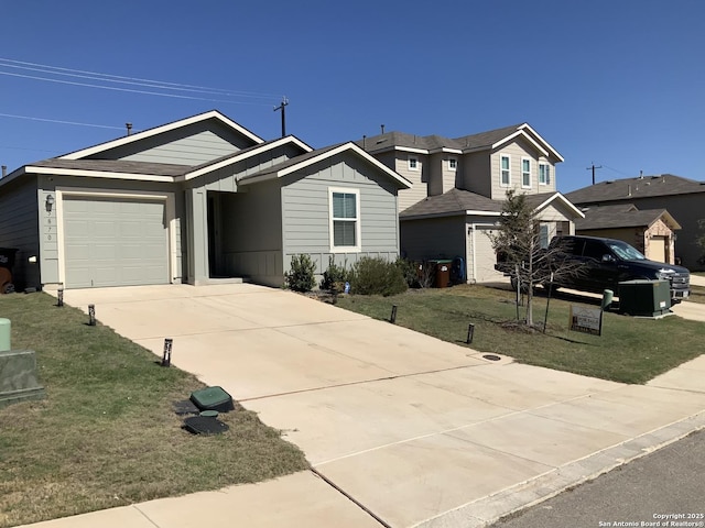 view of front of house featuring driveway, an attached garage, a front lawn, and board and batten siding