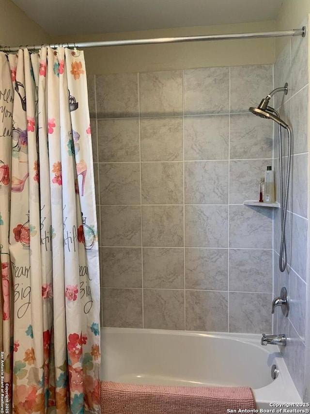 bathroom with shower / bathtub combination with curtain