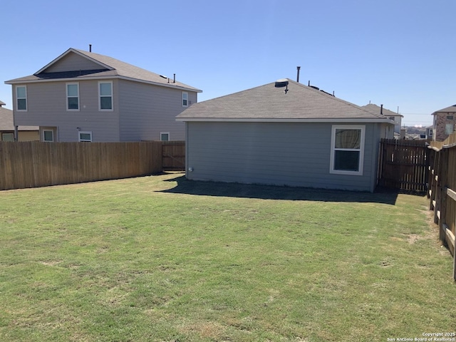 view of yard with a fenced backyard