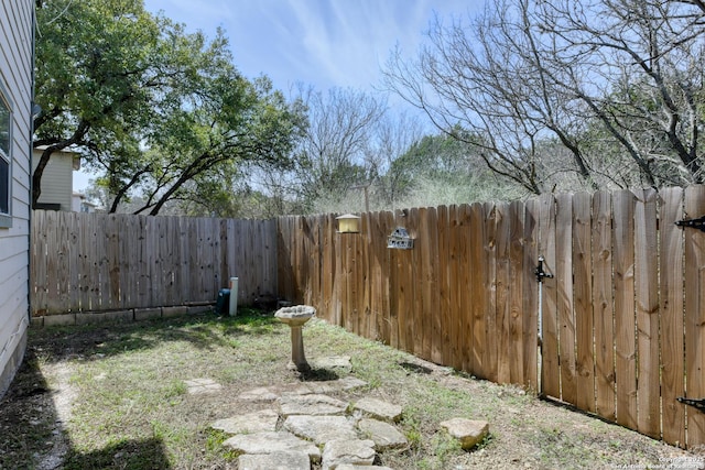 view of yard featuring a fenced backyard